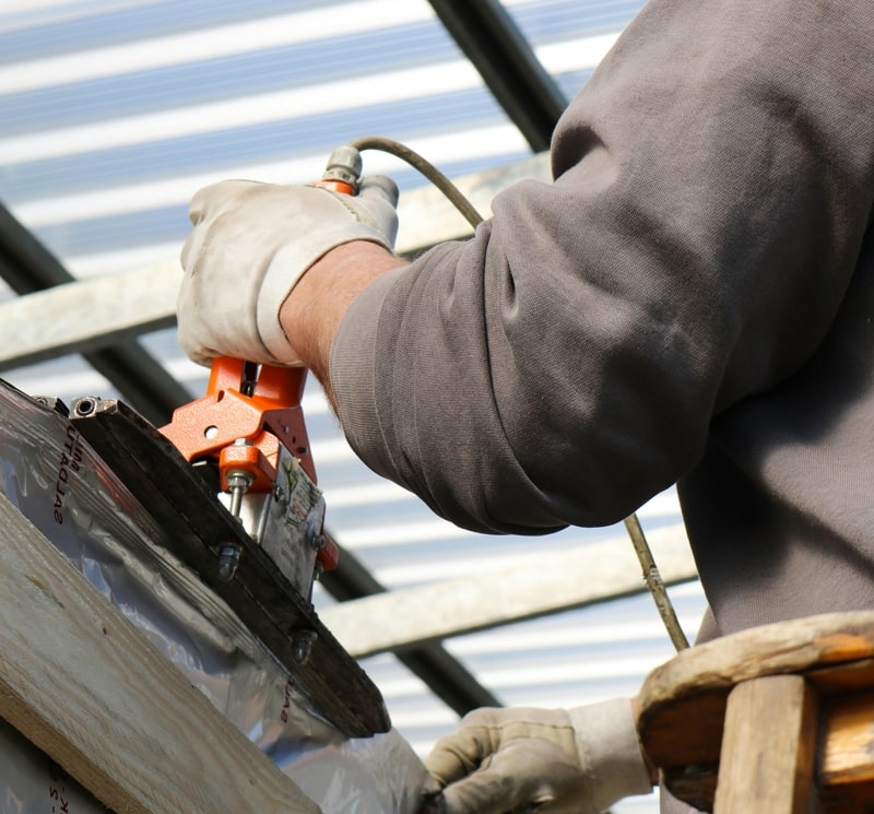 Roofers doing emergency repairs